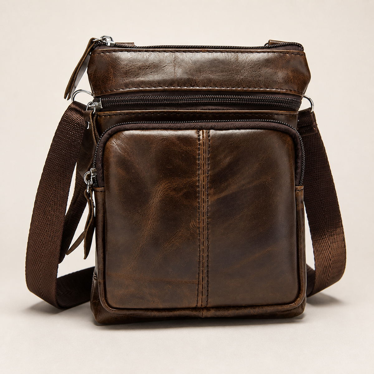 STRAYN compact leather crossbody messenger bag in Coffee brown